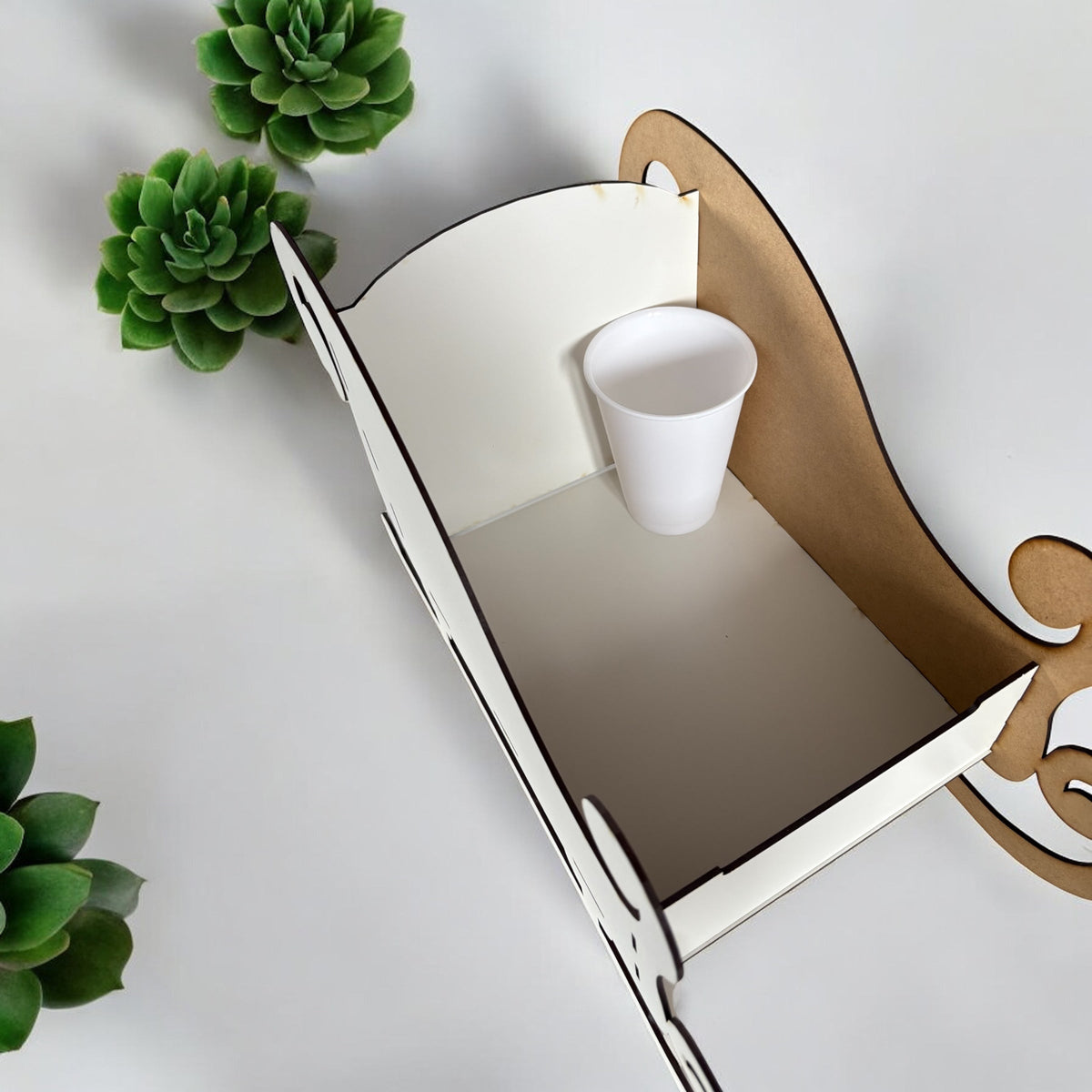 42cm freestanding Christmas sleigh shown with 16oz cup for size reference