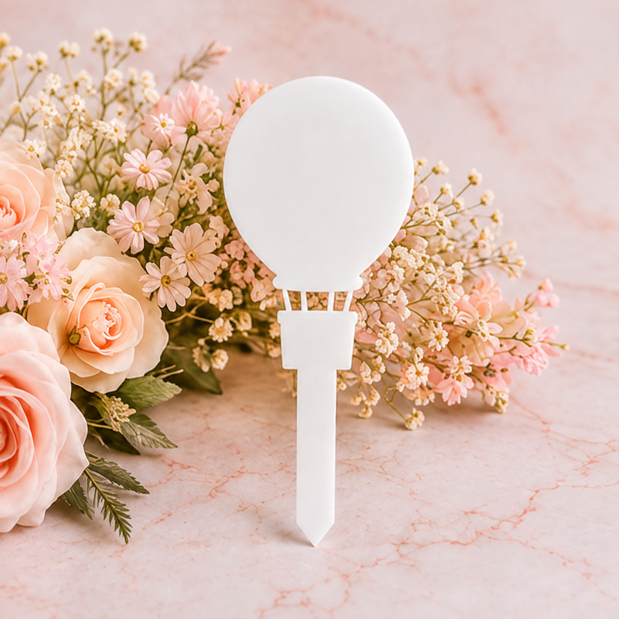 White acrylic air balloon grave marker blank on blush floral background