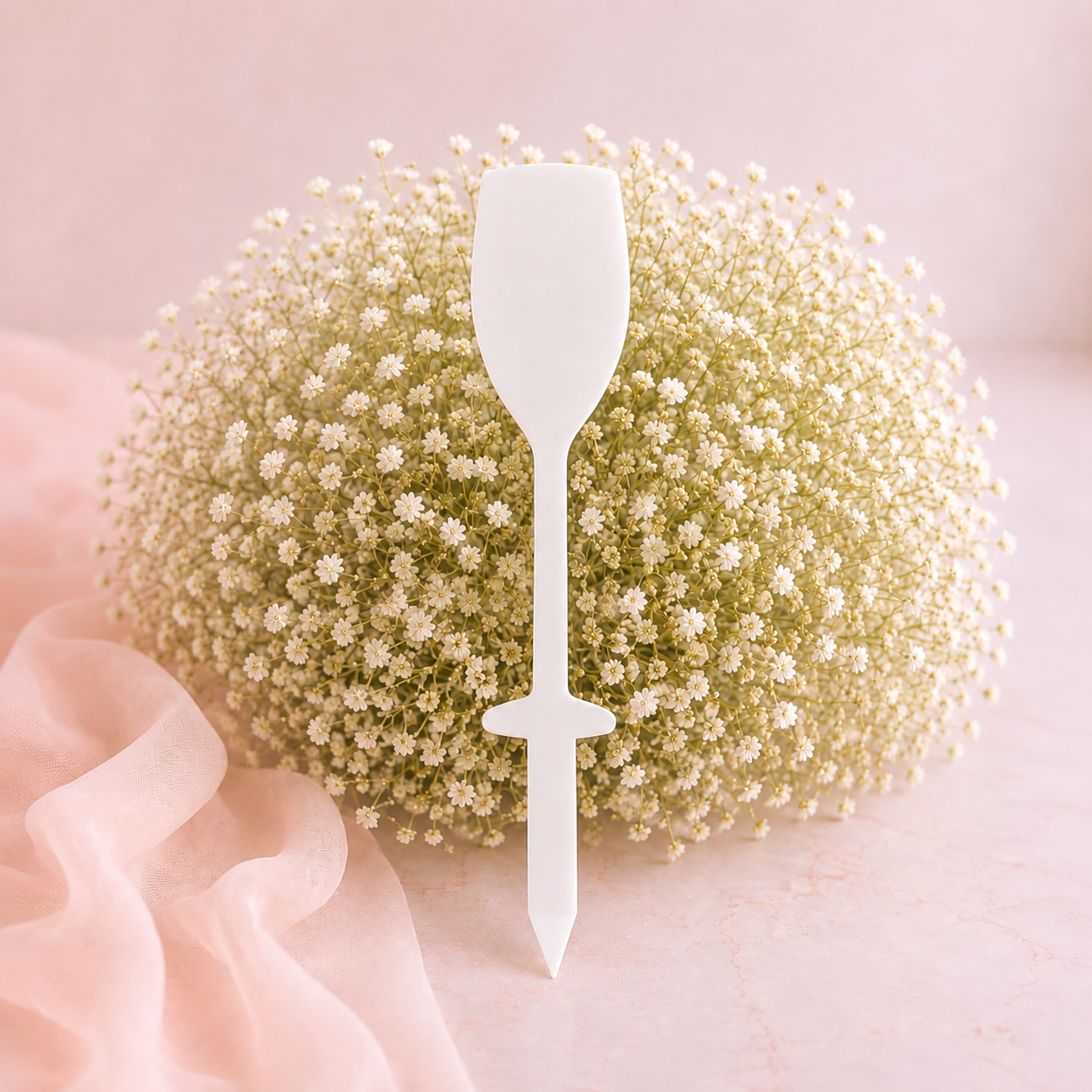 White acrylic Prosecco glass grave marker blank on blush floral background