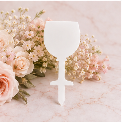 Gin Glass Grave Marker on blush floral marble background